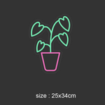 LED-neonskilt monstera med hjerteblad, grønt og rosa lys; størrelse 25x34 cm.