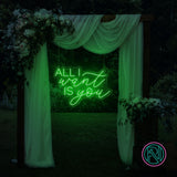 LED-neonskilt med «ALL I want IS you», grønt neonlys.