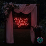 LED-neonskilt med «ALL I want IS you», rosa/rødt neonlys.