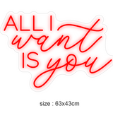 LED-neonskilt «ALL I want IS you» i rødt, størrelse 63×43 cm.