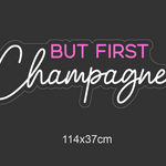 LED-neonskilt med teksten «BUT FIRST Champagne…» og mål 114×37 cm