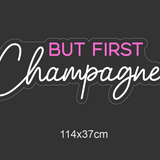 LED-neonskilt med teksten «BUT FIRST Champagne…» og mål 114×37 cm