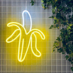 LED-neonskilt i bananform, sitrongult lys.