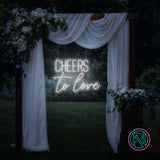 LED-neonskilt med «CHEERS» og «to love» i kaldhvitt neonlys