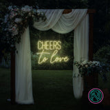 LED-neonskilt med «CHEERS to love», lysende gulgrønn