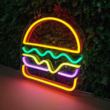 LED-neonskilt hamburger med gul øvre del og grønt, lilla og rødt lys