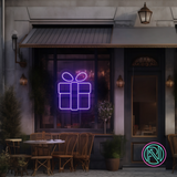 LED-neonskilt med julegave-symbol, lilla rosa glød