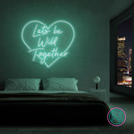 LED-neonskilt i hjerteform «Lets be Wild Together», turkis glød.