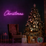 LED-neonskilt med «Christmas» i rosa-lilla lys.