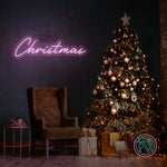 LED-neonskilt med «Christmas» i magenta-rosa lys.