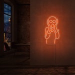 LED-neonskilt med kontur av skrikende figur, lysende oransje
