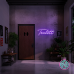 LED-neonskilt med teksten «Toalett» i rosa magentalys