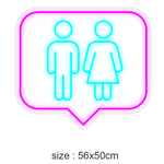 LED-neonskilt i snakkebobleform med toalett-symboler, rosa kant, turkis figurer, 56×50 cm
