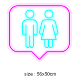 LED-neonskilt i snakkebobleform med toalett-symboler, rosa kant, turkis figurer, 56×50 cm